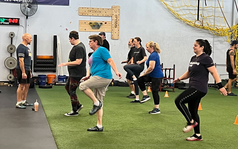 Tucson Strength Original Strength Class practices foundational movements in their Tucson Group Fitness class.